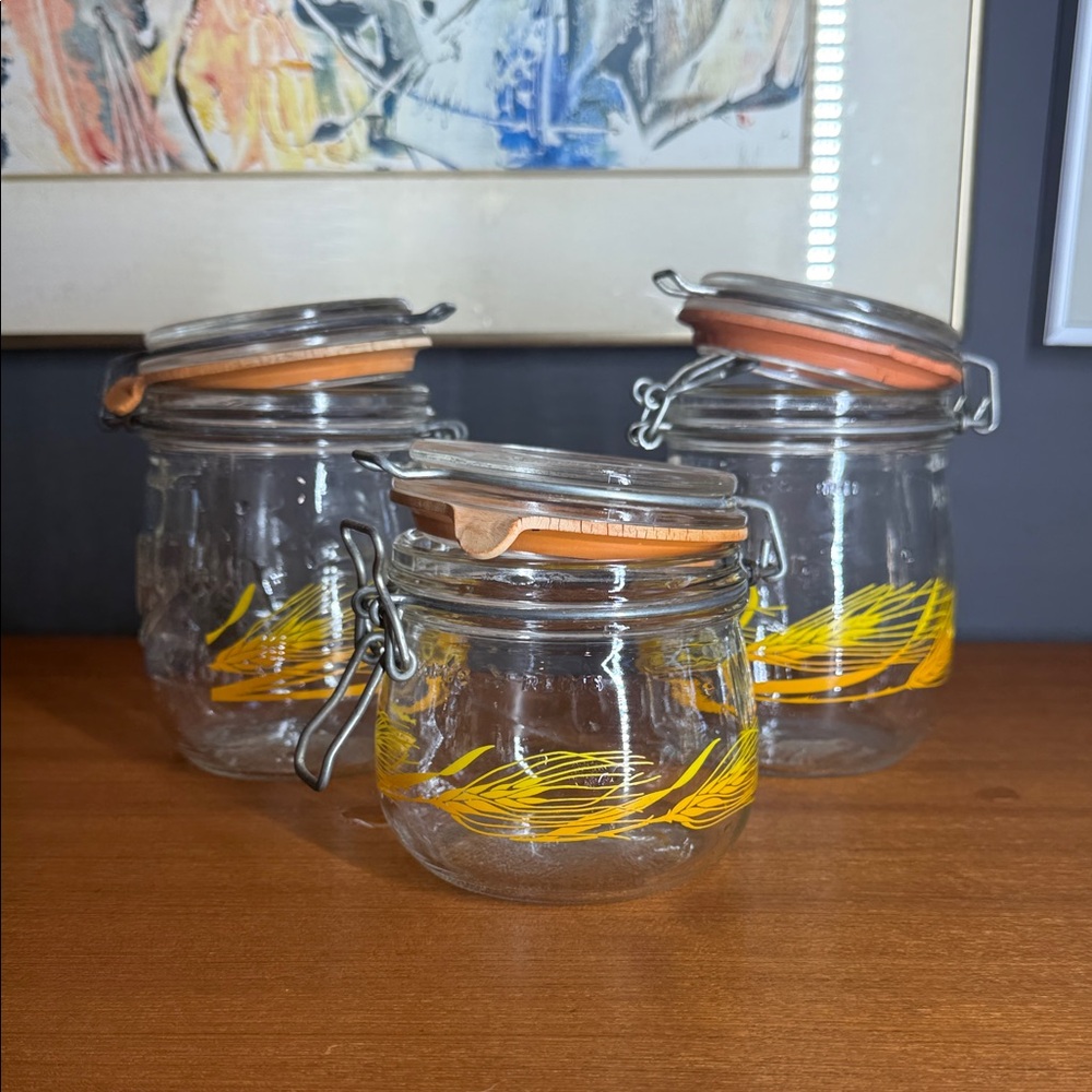vintage set of Arc France glass canisters with a wheat design